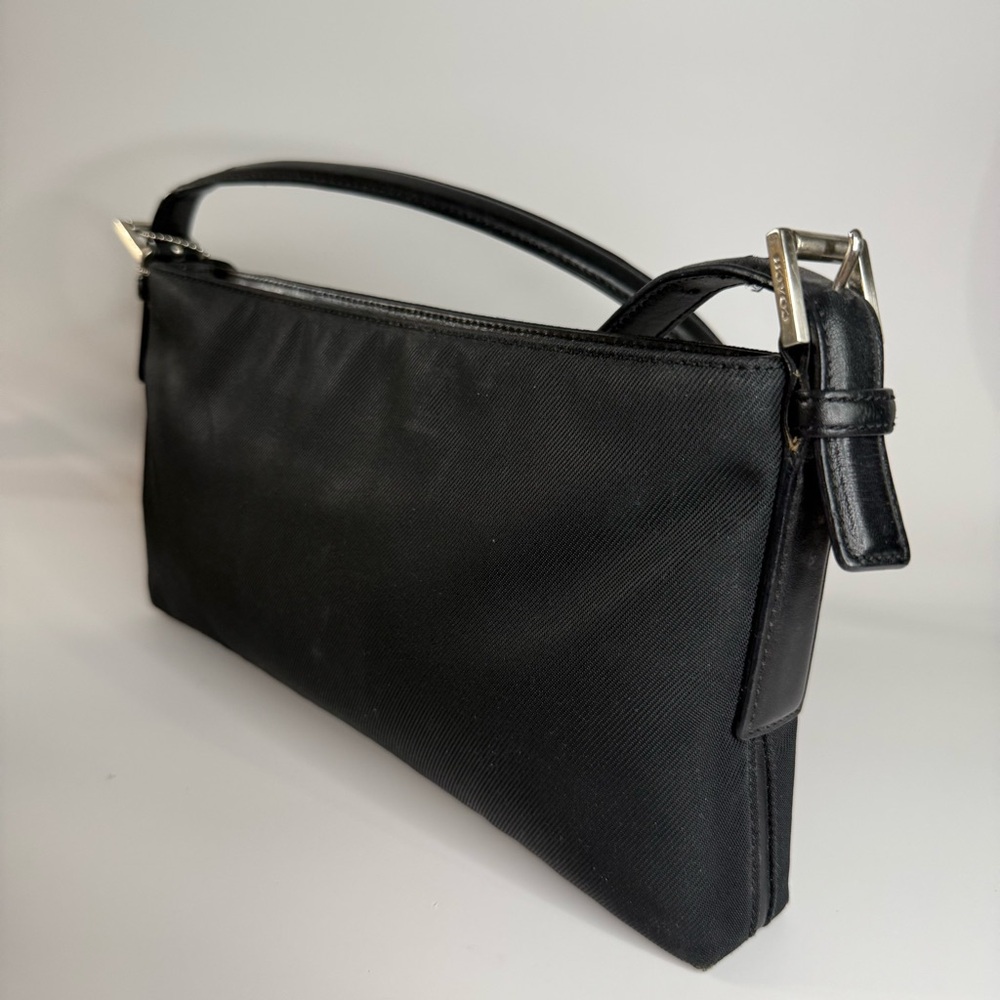 Coach Black Bag with Adjustable Strap and Minimalist Design